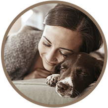 Woman cuddling with a dog: New Client Registration in Temperance