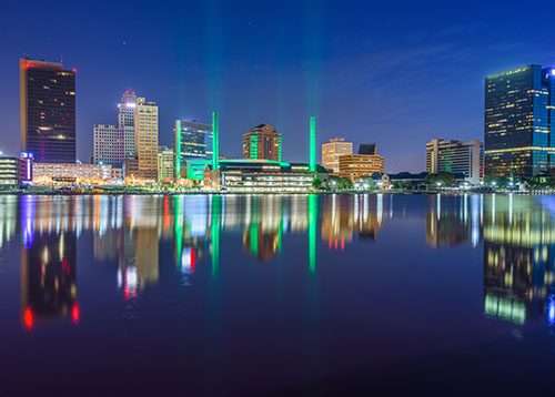 Toledo, Ohio downtown skyline on the Maumee River at night